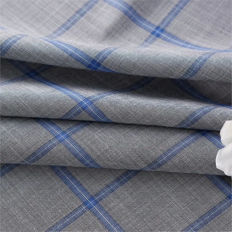 De stof voor modieuze heren- en damescasual pakken, werkkleding, rokken, broeken