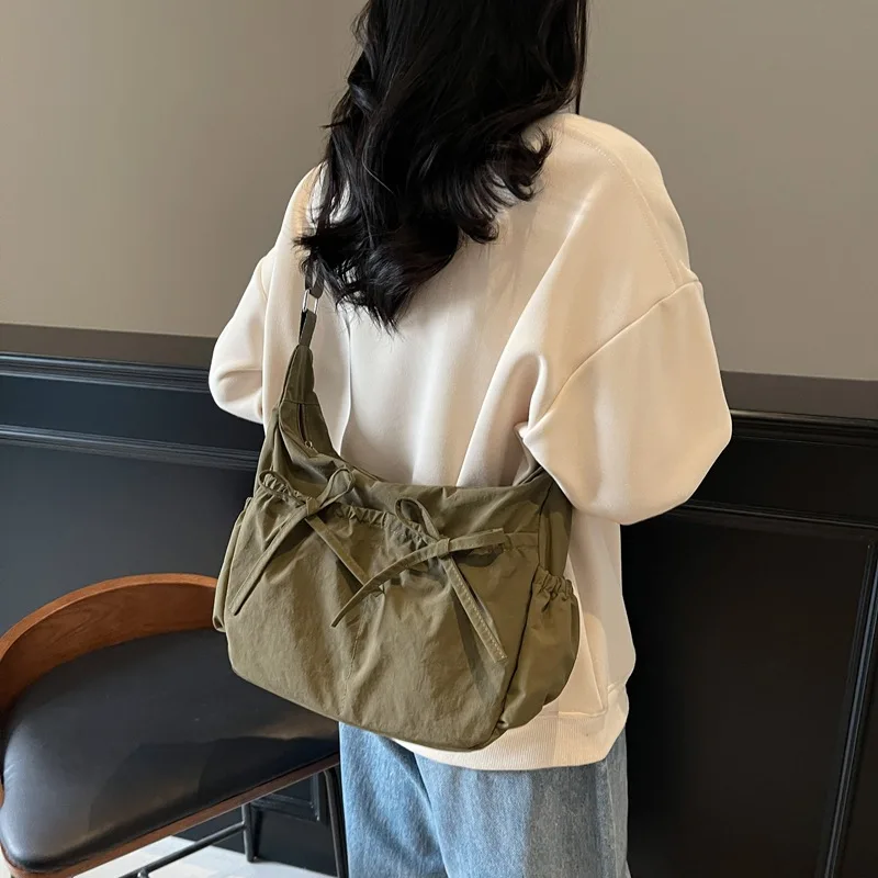 

Versatile Textured Travel Bag. This spacious, lightweight crinkle tote seamlessly transitions from travel to daily errands.