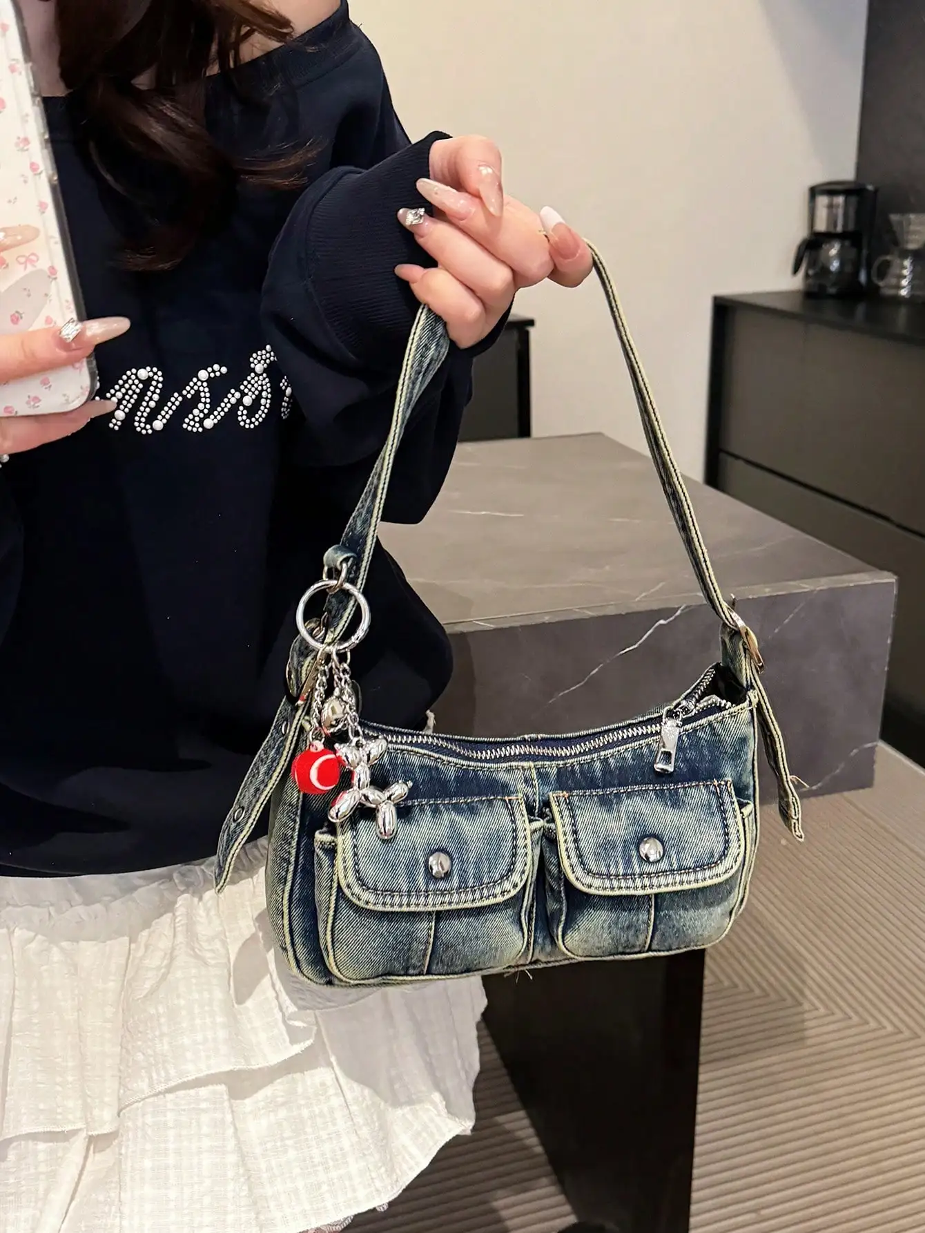 

Distressed Denim Mini Shoulder Bag with Front Pockets and Charm Strap