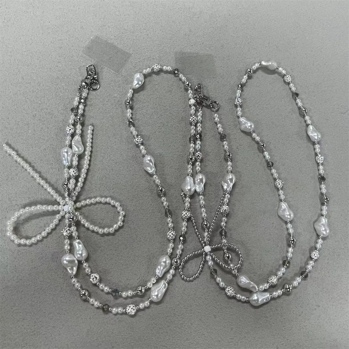 

Цепочка через плечо с жемчужным бантом и бисером, модный и универсальный чехол для телефона, подвесная веревка для телефона