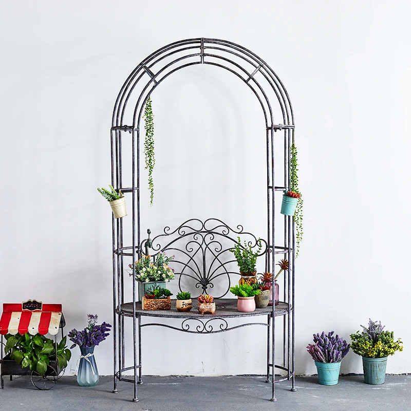 

The original order is an old wrought iron clematis climbing vine frame, arch seat flower stand.