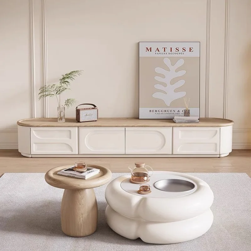 

Комбинация круглого журнального столика кремового цвета. Современная простая гостиная. Новый журнальный столик из зефира. Комбинация шкафов для телевизора.