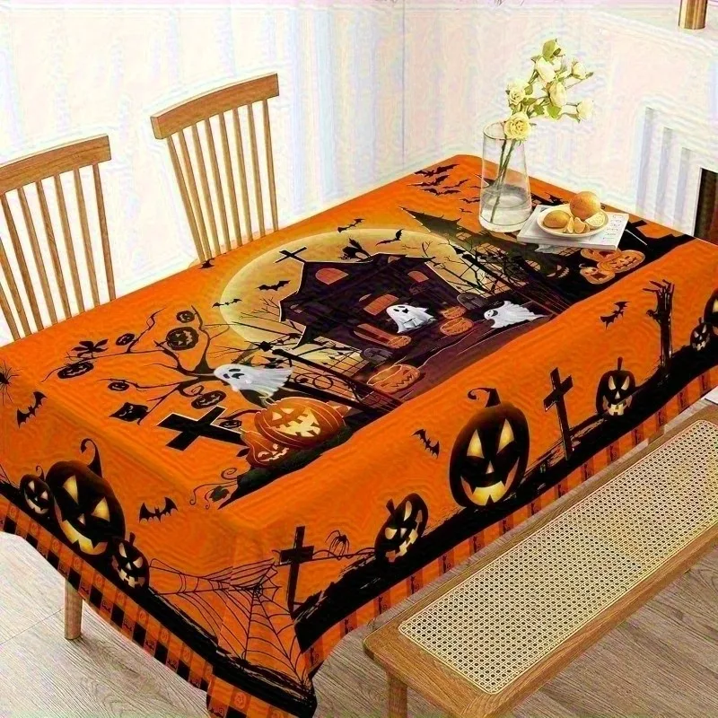 One Halloween tablecloth, in a rectangular design, featuring patterns of pumpkins, castles and ghosts.