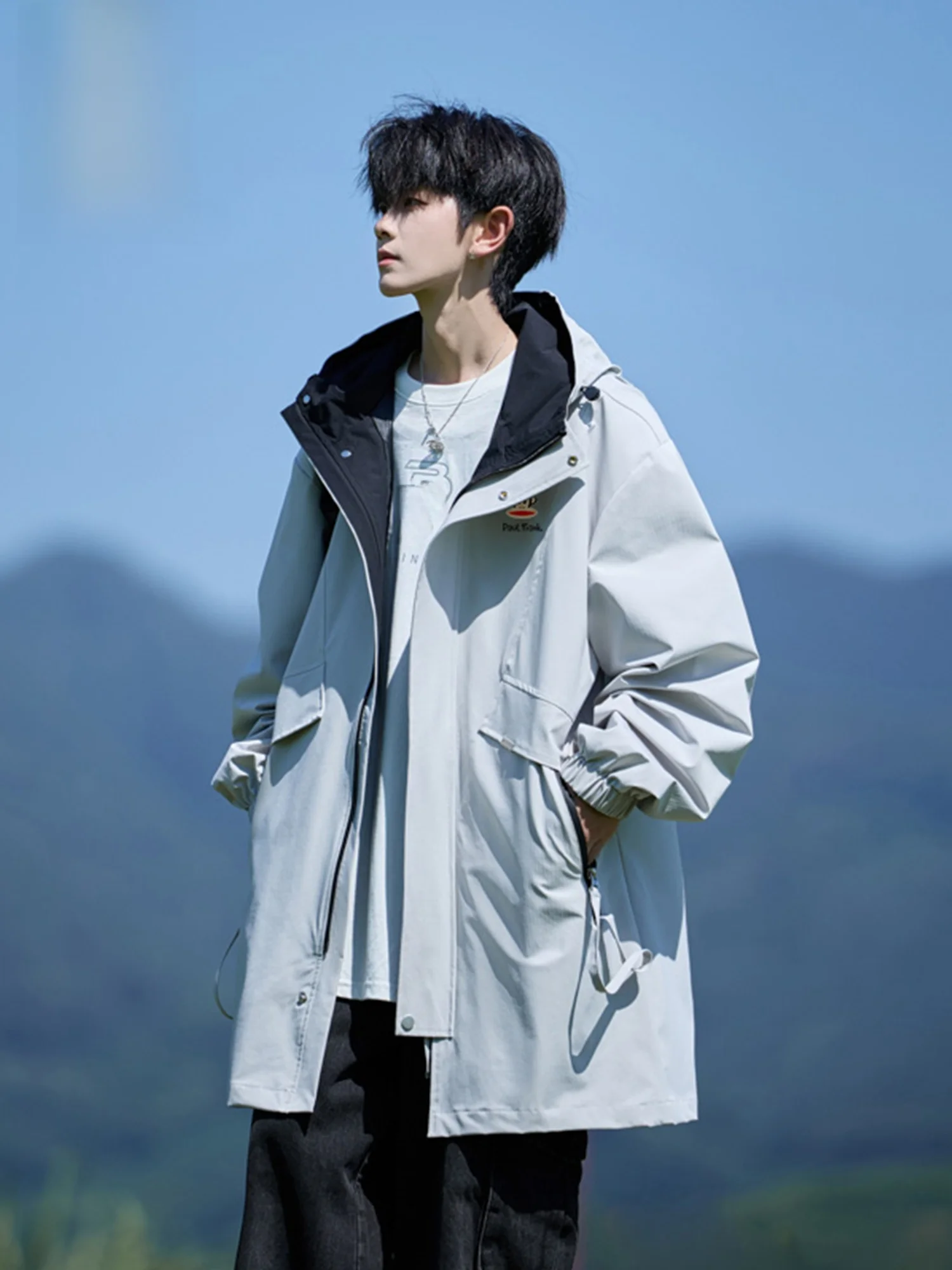 

Мужская ветровка Paul Frank средней длины с капюшоном, осень-зима 2025, защита от холода, модная свободная рабочая куртка, молодежная повседневная, полиэстер