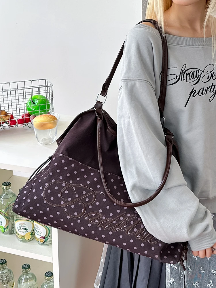 

Korean-style leopard print polka dot handbag for women2026New large-capacity embroidered drawstring canvas tote bag for commutin