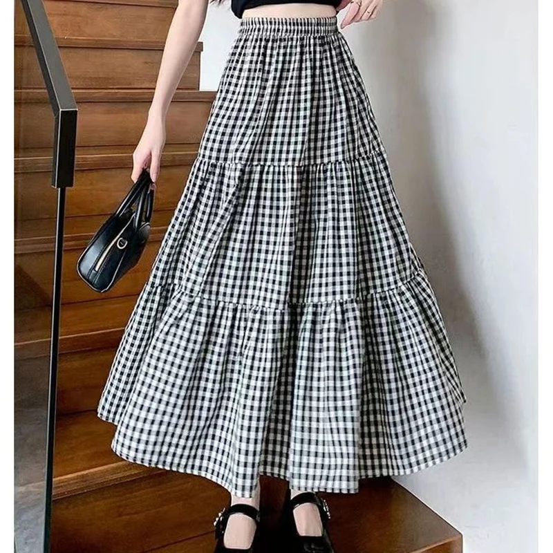 

Fashion Elastic Spliced Casual Plaid A-Line Skirts Female Clothing 2025 Summer New Loose Preppy Style High Waist Skirts
