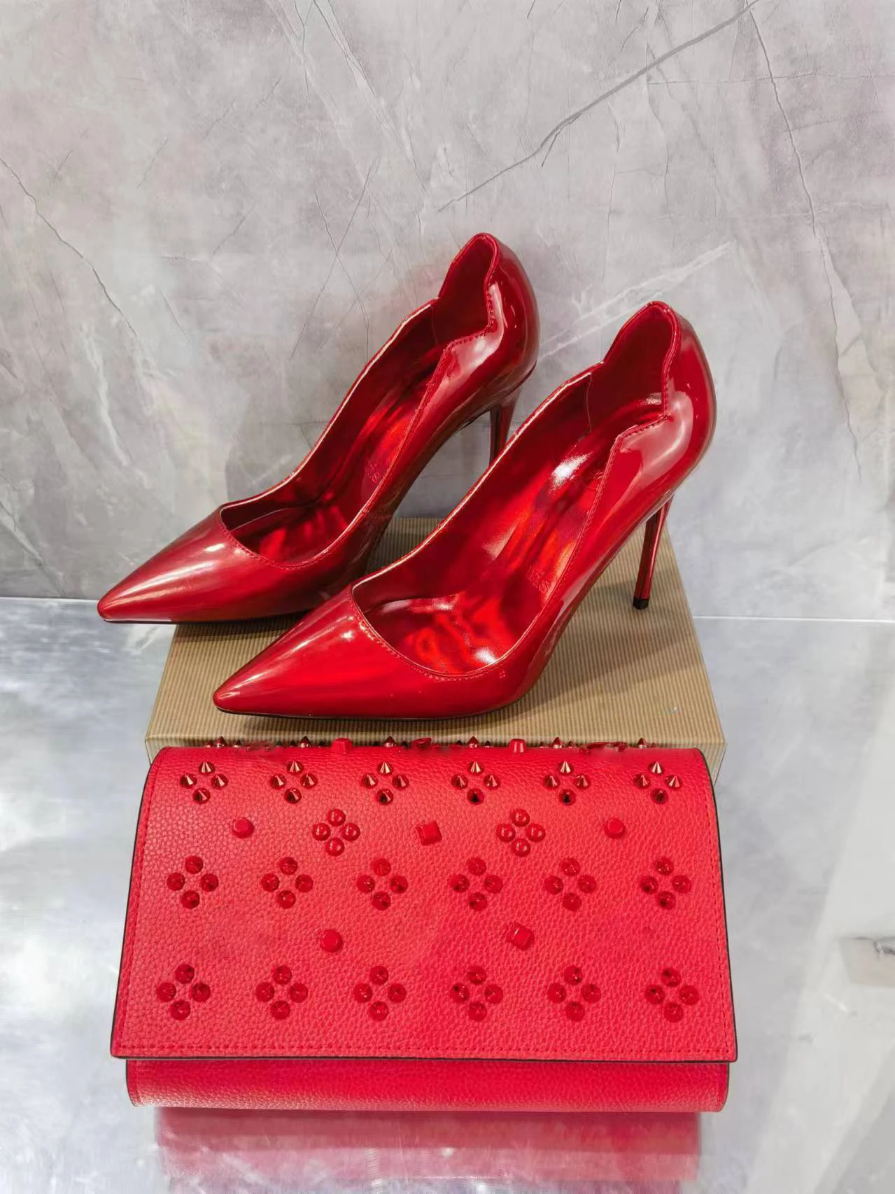 Women's Red Patent Leather Pointed Toe Stiletto Heel Shoes Matching Red Studded Clutch Set Glamorous Elegant Footwear Accessory
