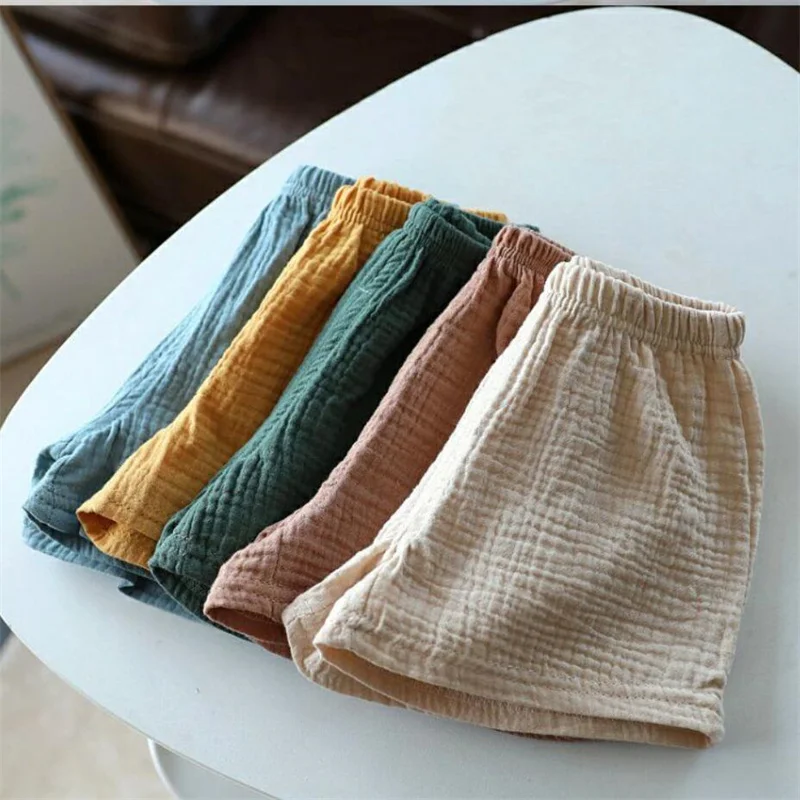 Shorts de algodão e linho para meninas e meninos, cor sólida, calças de cinco pontos para crianças, roupas de bebê, verão