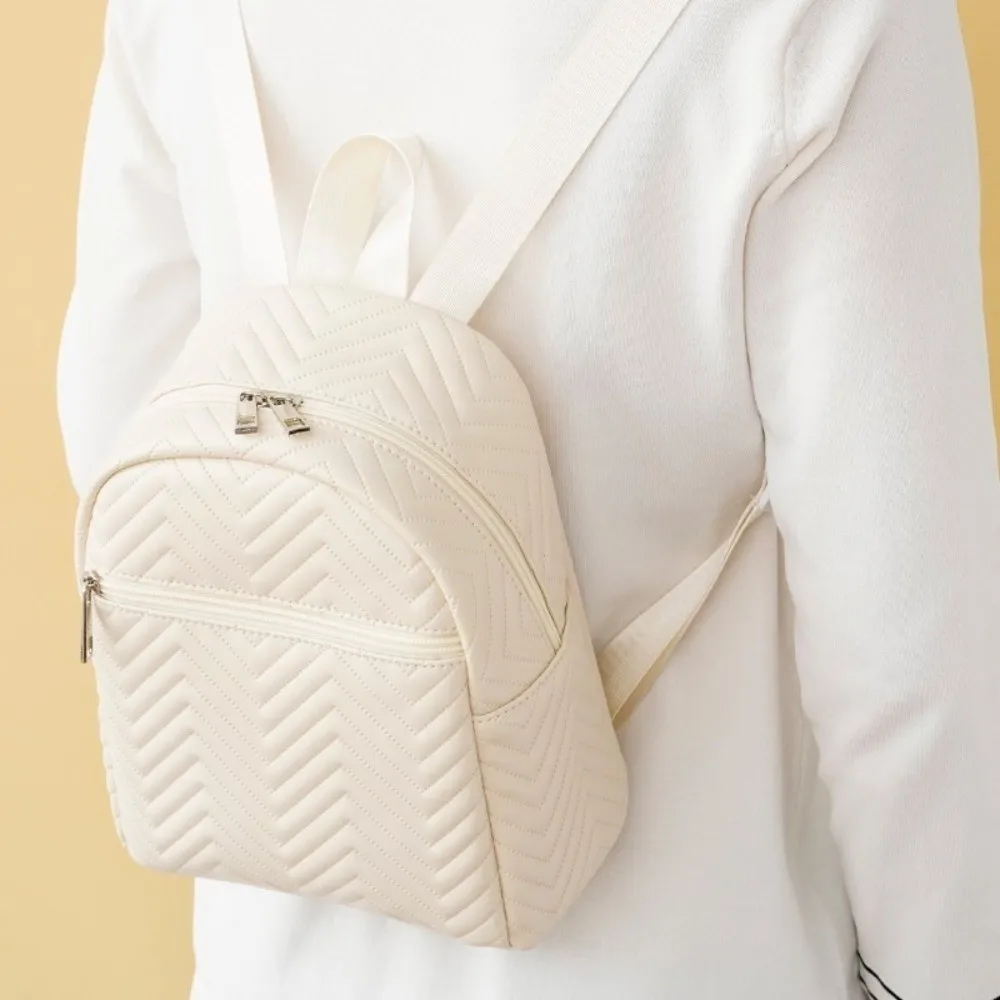 กระเป๋าเป้สะพายหลังลายสามเหลี่ยมสไตล์เกาหลีเรียบง่ายหรูหราสีทึบกระเป๋าหนัง PU ซิปสแควร์กระเป๋ามินิเด็กของขวัญ