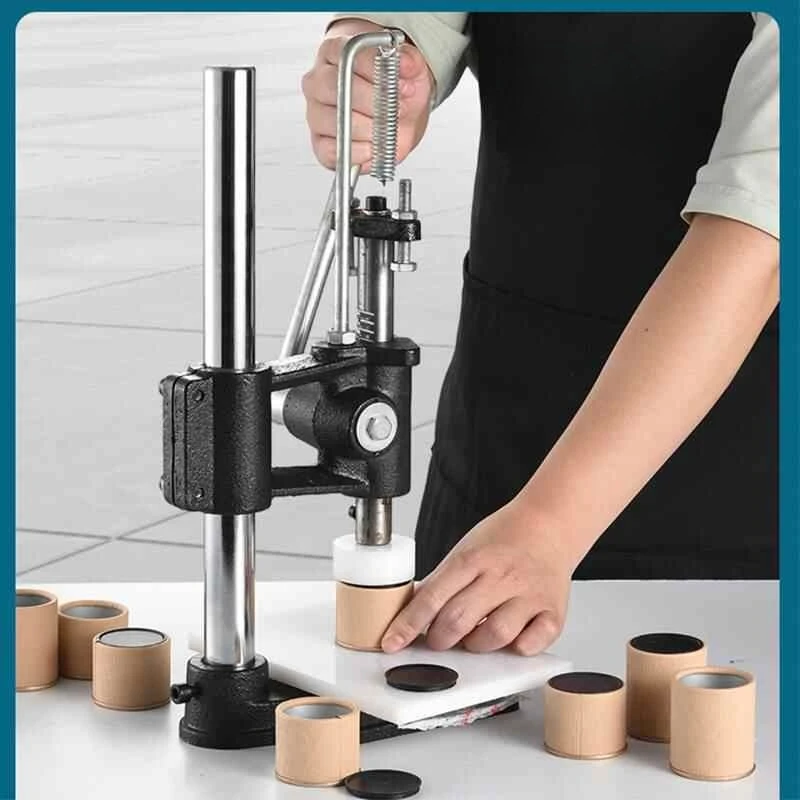 آلة تغطية علب الشاي آلة تغطية الإبزيم بالضغط اليدوي آلة تغطية الإبزيم التجارية