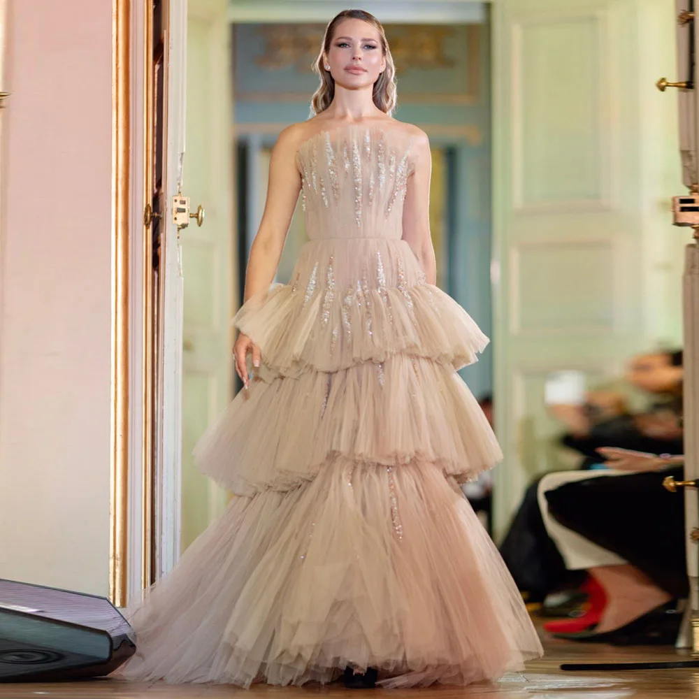 Chic Beige Tiered Gown With Gold Sequins Shining Brightly On Each Layer Flowing Fabric Creates Graceful Movement Perfect For