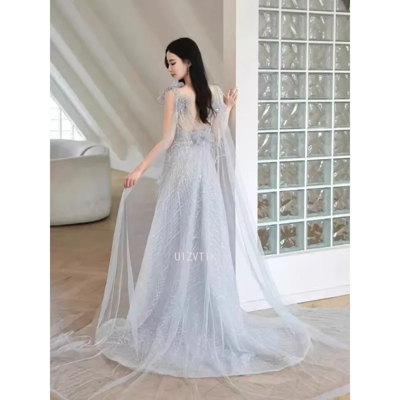 فساتين نسائية زرقاء طويلة لحفلات الزفاف أنيقة مزينة برقبة على شكل حرف v بدون أكمام من التل فستان سهرة فستان حفلات