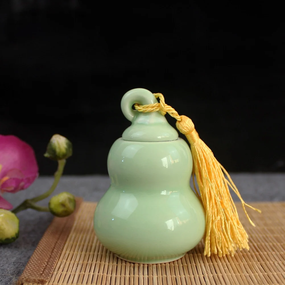 

Green Mini Ceramic Tea Jar Gourd Shape Bottle Tin Lid Storage Pot for Tealeaves Powder Cream Ointment Travel Kitchen Decor