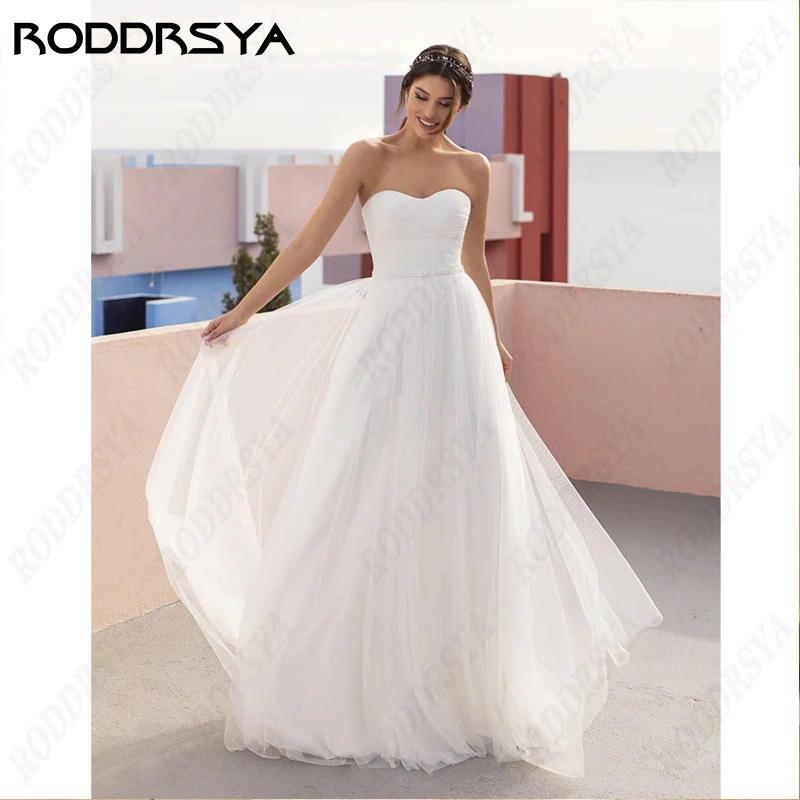 RODDRSYA Simples Strapless Vestido De Noiva Para As Mulheres Sem Mangas Pérolas Backless Lace Vestidos De Novia Tulle A Linha Noiva FestaSimples Strapless Vestido De Noiva Para As Mulheres Sem Mangas Pérolas Backless L