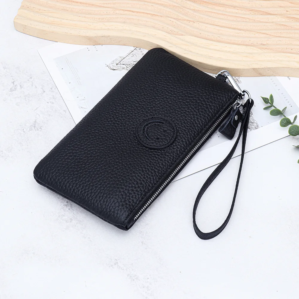 2025年新作 レディースクラッチバッグ 本革 牛革 コインケース カードホルダー ファッションデザイナー 笑顔の顔付き スマホ財布 パーティーバッグ