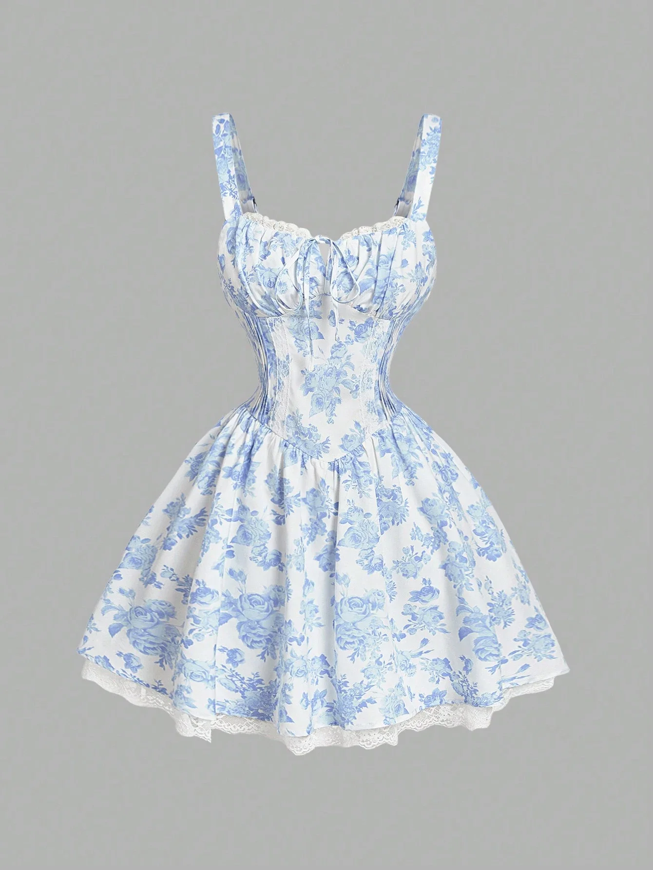 

Сине-белое мини-платье с цветочным принтом, кружевной отделкой и перекрестной спинкой на бретельках