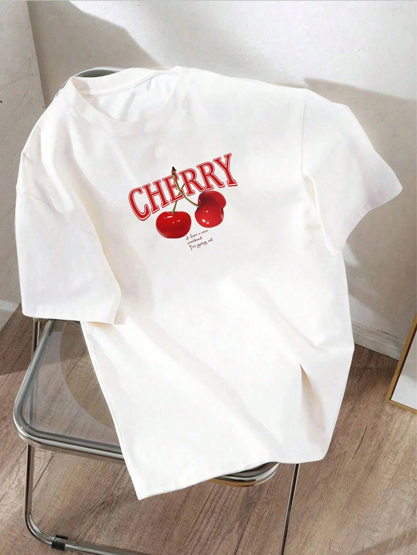 2026 Men's white knitted round-neck short-sleeved T-shirt with lettering and cute cherry pattern print, suitable for outings.