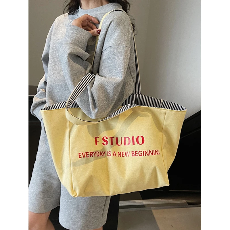 

2025 new large-capacity portable canvas bag letter double-sided tote bag versatile fashion lazy shoulder bag