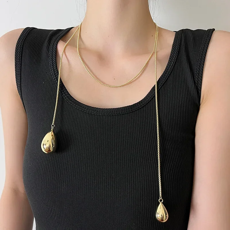 

Water drop pendant pulling snake bone women's high-end sweet and cool sweater necklace