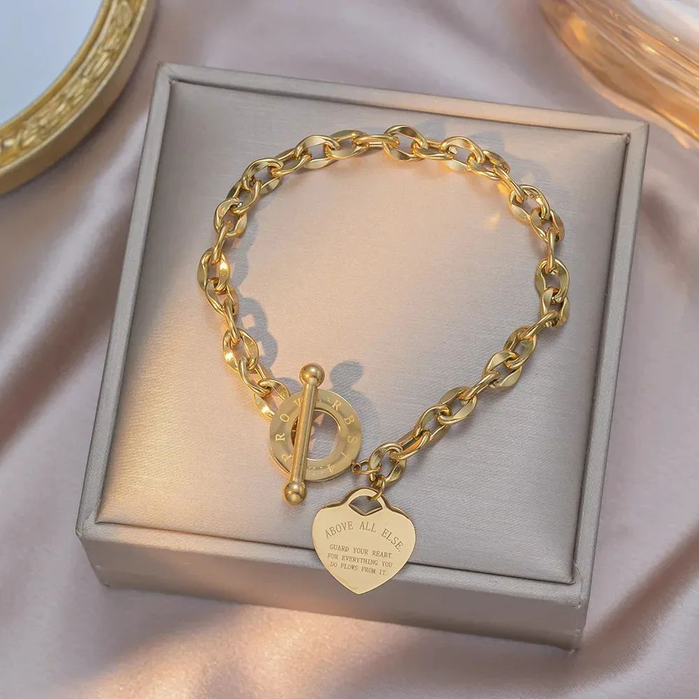 

Stainless Steel Heart Charm Link Chain with Light Luxury OT Toggle Clasp – Elegant for Women Gril Fashion Bracelet Jewelry Gift