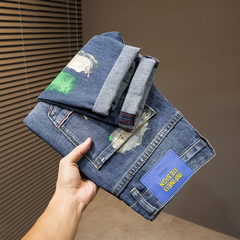 2024 New light luxury Blue MEN'S jeans fashion hole patches tide elastic slim embroidery spray paint straight casual denim pants