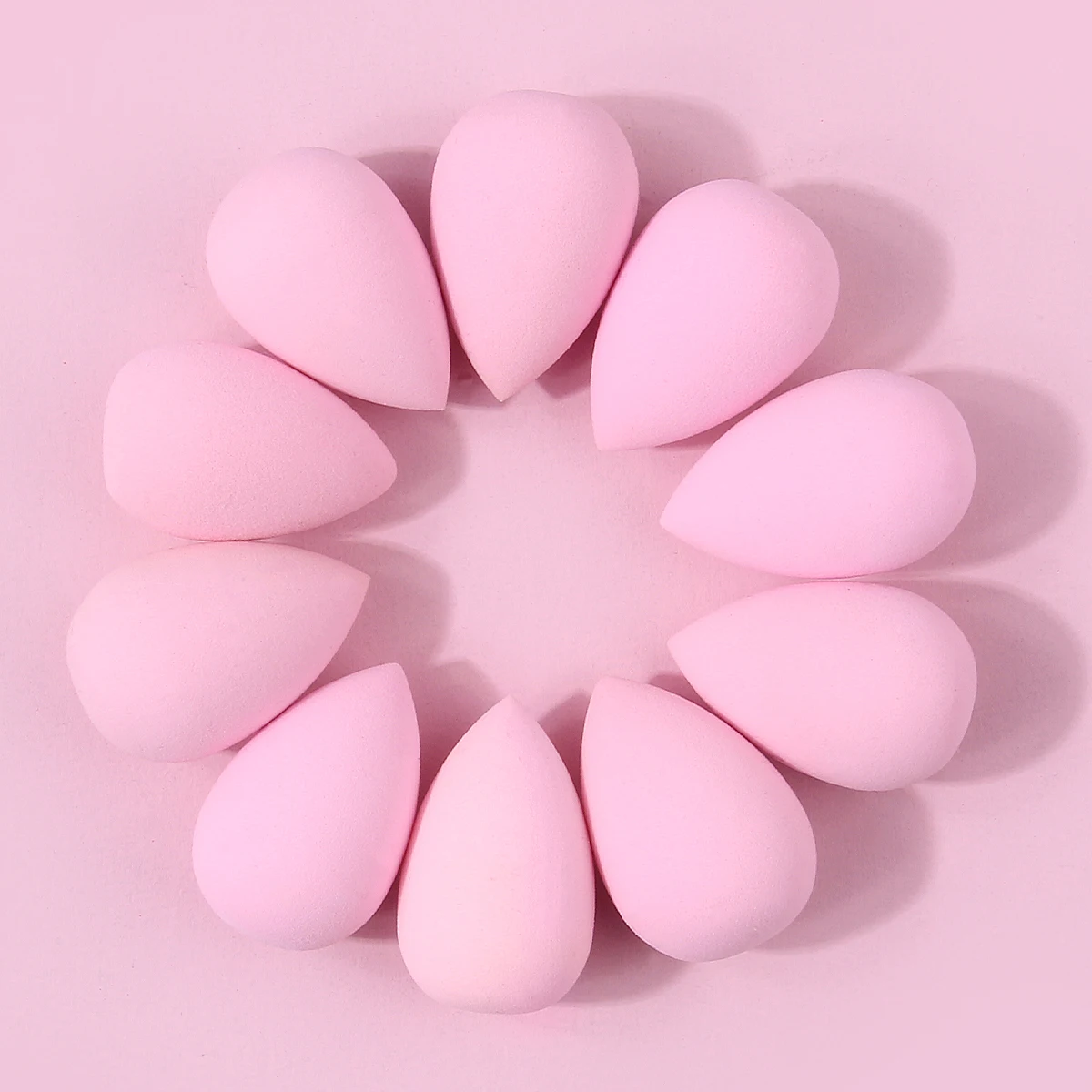 Juego de mini huevos de esponja de maquillaje rosa, 10 Uds., que se exponen al agua, es una herramienta de maquillaje facial natural para aplicar el maquillaje
