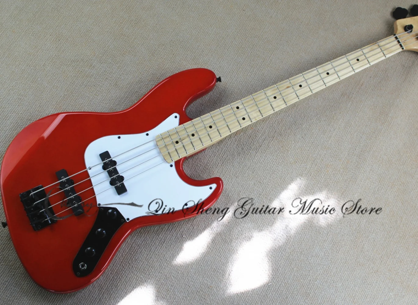 Custom 5 string red bass, fixed bridge, solid wood body, maple neck, white pickup guard plate, black tuners