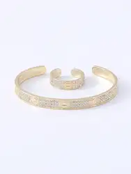 Un set di nuovi vestiti da donna europei e americani placcati in oro 14 carati semplice giorno creativo pieno di vestito ad anello con bracciale in zirconio