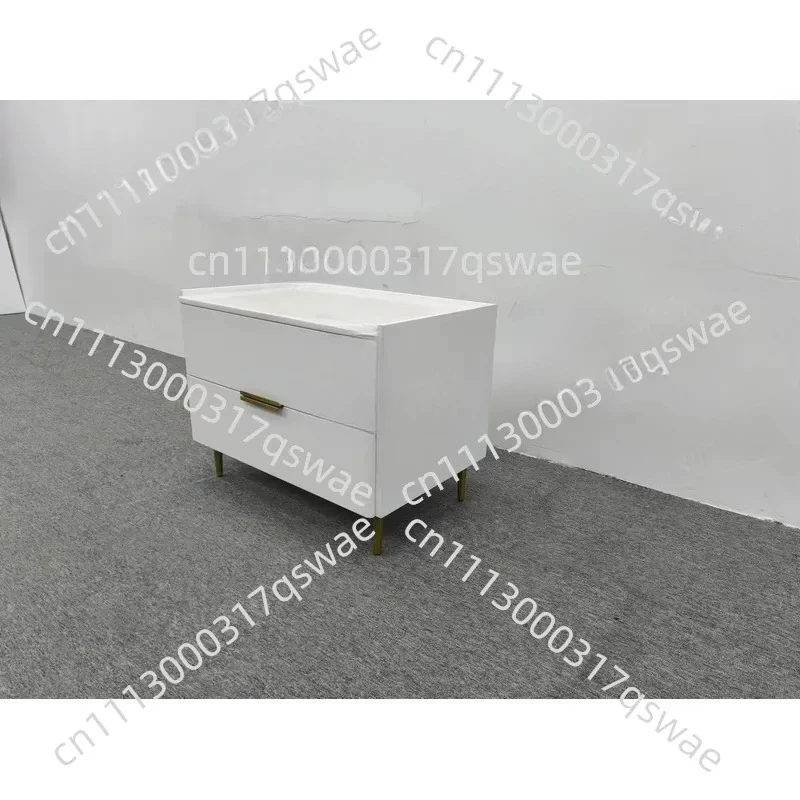 Compact white bedside table with two drawers, gold legs, stone countertops, small bedroom locker