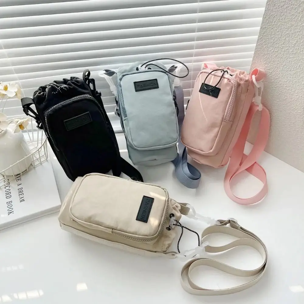

Nylon Water Bottle Carrier Bag Shoulder Strap Handle Water Bottle Holder Phone Pocket Drawstring Crossbody Water Bottle Purse