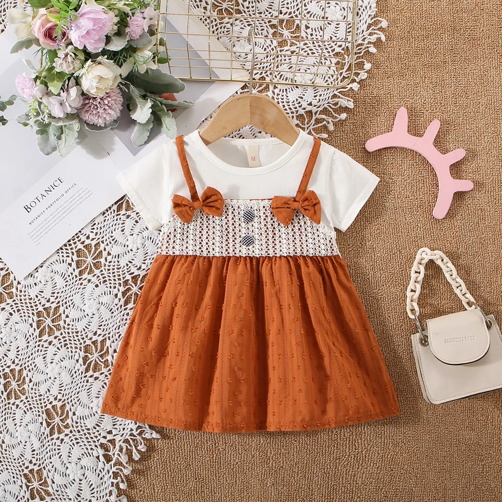 Summer baby girl dress baby girl fake two pieces of pure white short sleeved two small bow strap dress