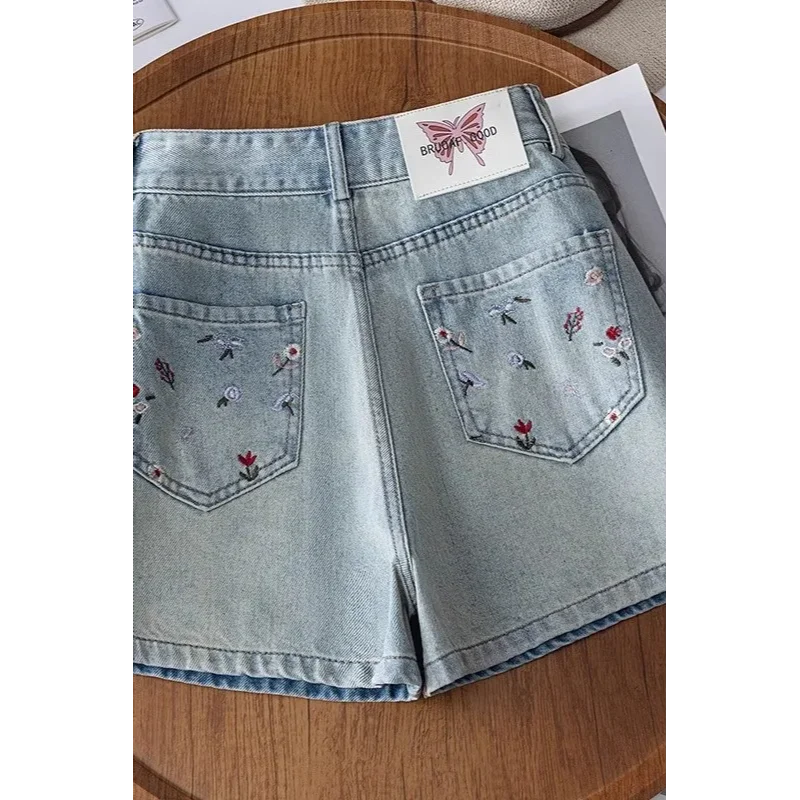 Jasnoniebieskie dżinsowe szorty z wysokim stanem, haftem kwiatowym, codzienne, letnie, damskie, w kształcie litery A, modne.