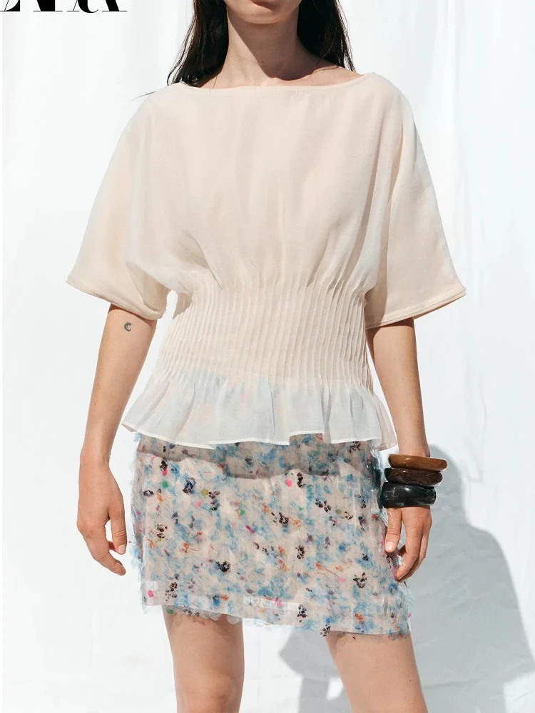 

European style new women's fashion versatile temperament French niche knitted transparent hard yarn splicing top