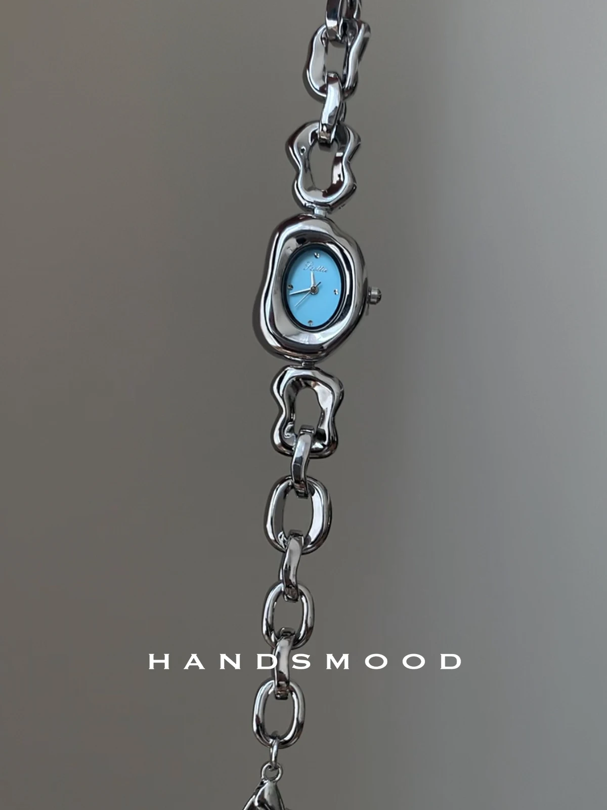 

Elegant women's wristwatch, irregular silver-blue design, fashionable and sophisticated women's bracelet style watch.