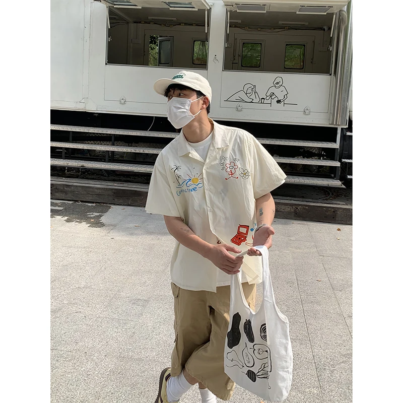 

Summer New American Retro Hand-dn fiti Print ort-sved Loose irt Men's Casual Loose irt No-iron Procing