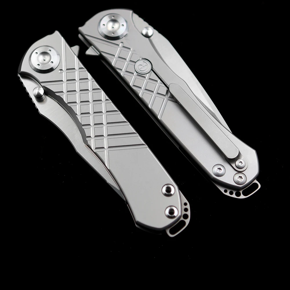 Cuchillo plegable con mango de titanio Chris Reeve Umnumzaan 100% N690