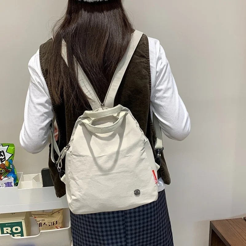 mochila-versatil-impermeavel-fena-2025-nova-primavera-verao-viagem-portatil-tecido-de-nylon-cor-pura-estilo-artistico-ret