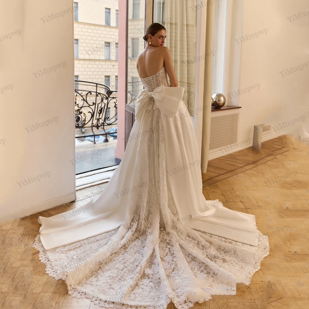 فساتين زفاف عتيقة مع فيونكة بدون حمالات على شكل حرف a فيستدو دي نوفيا بودا مزينة بدون أكمام وأربطة فساتين العروس حسب الطلب