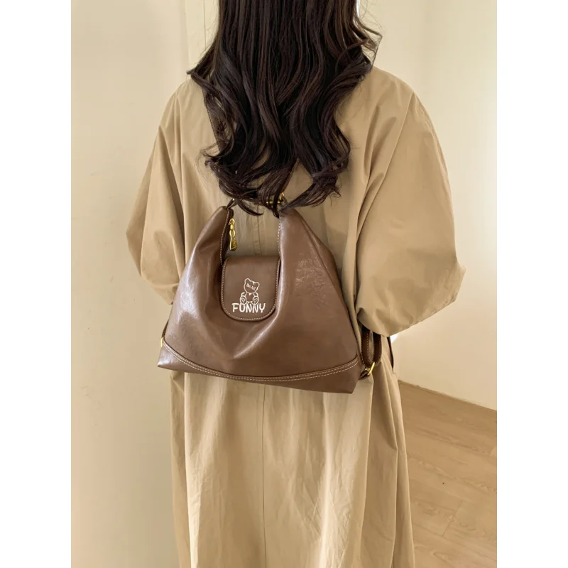 

Ретро-сумка-тоут для женщин, большая вместимость, универсальная сумка через плечо для поездок на работу, новинка 2025 года, многофункциональный рюкзак для студентов.