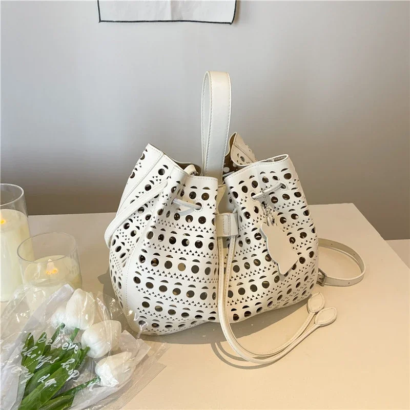 

Solid PU Super Cool Hollow Out PU Bucket Shoulder Bags 2026 High Quality Large Capacity Sense of Luxury Women's Crossbody Bags