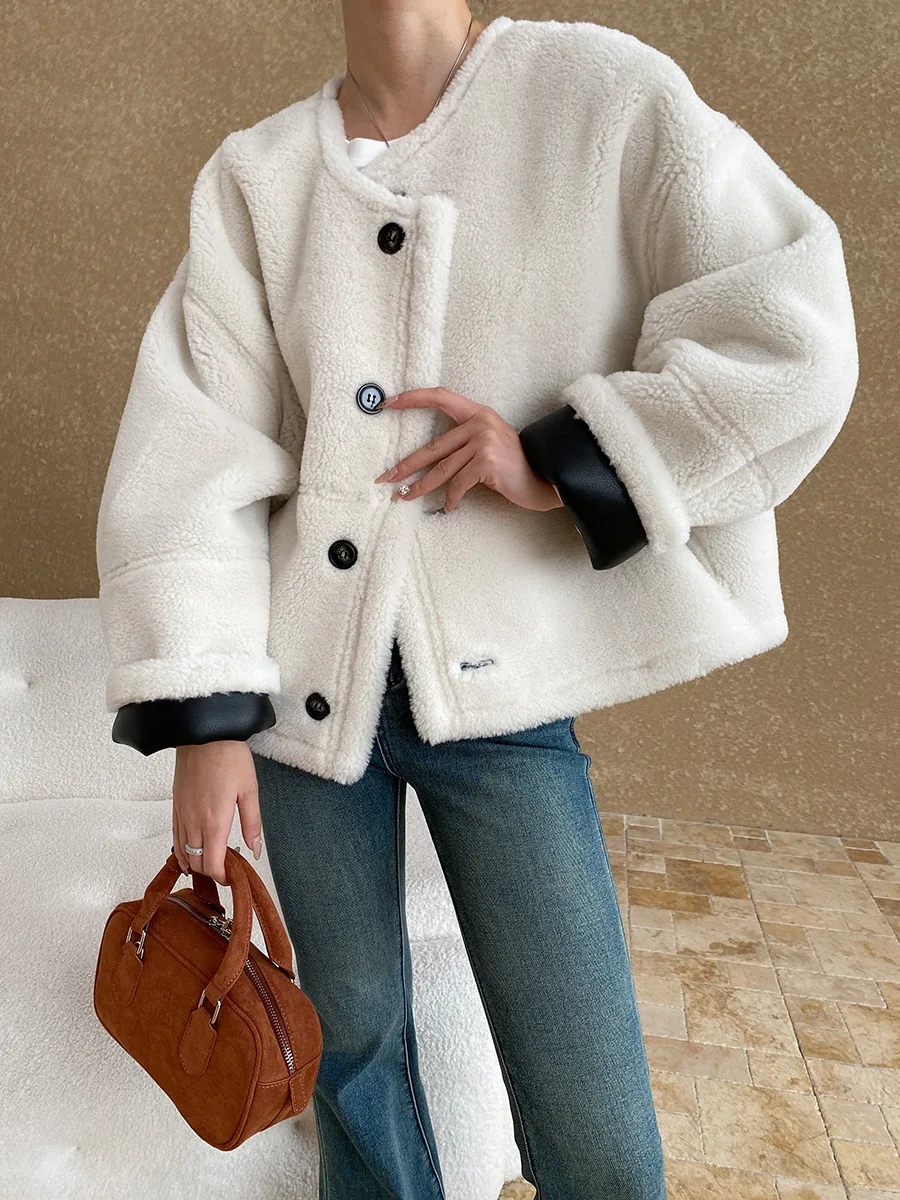 Winter women\'s casual solid color round neck long sleeved loose fur one-piece jacket