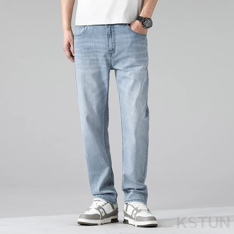 جينز طويل جدًا للرجال طويل القامة مستقيم أزرق فاتح كاجوال للأعمال بطول كامل ملابس رجالية قابلة للتمدد بطول ممتد