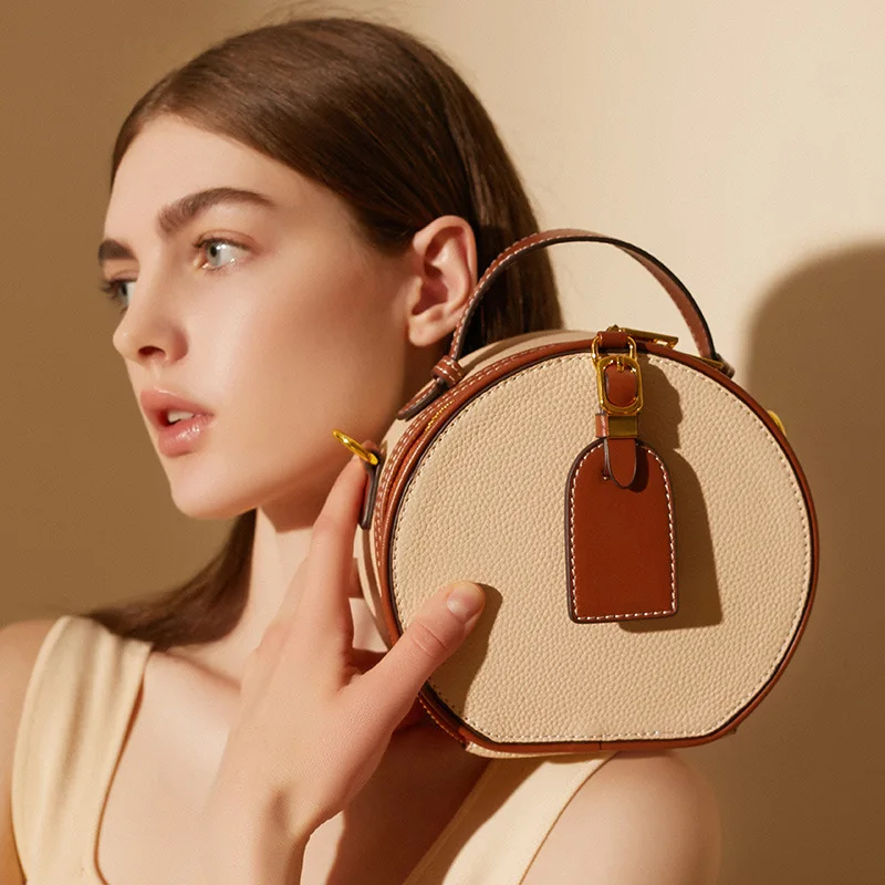 Bolso de piel auténtica para mujer, cartera versátil de piel de vaca con patrón de lichi en contraste, bandolera redonda para primavera y verano, 2023