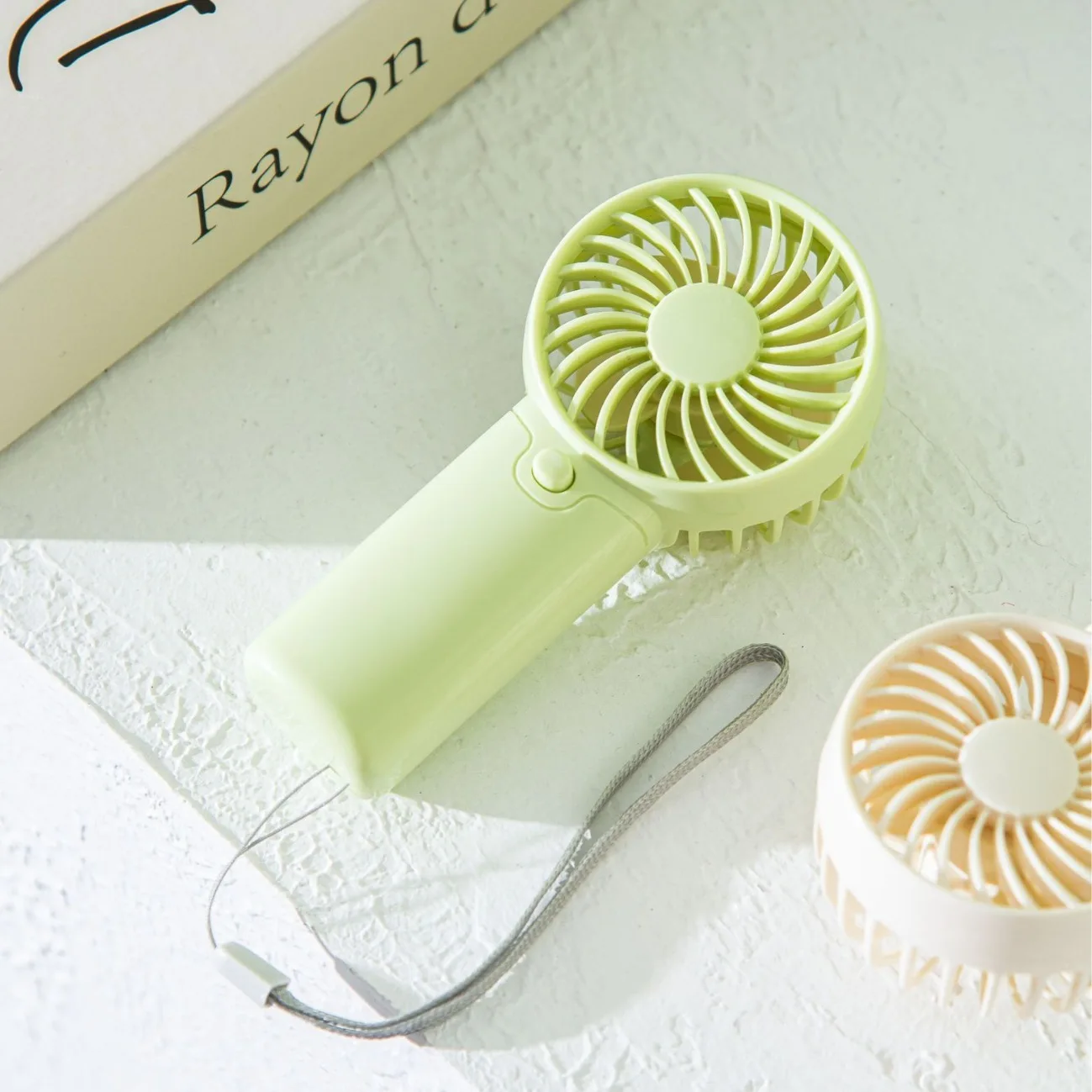 Multi-Color Compact Handheld Fan with Quiet Operation Portable Design and One-Touch Control for Home Office and Travel Available