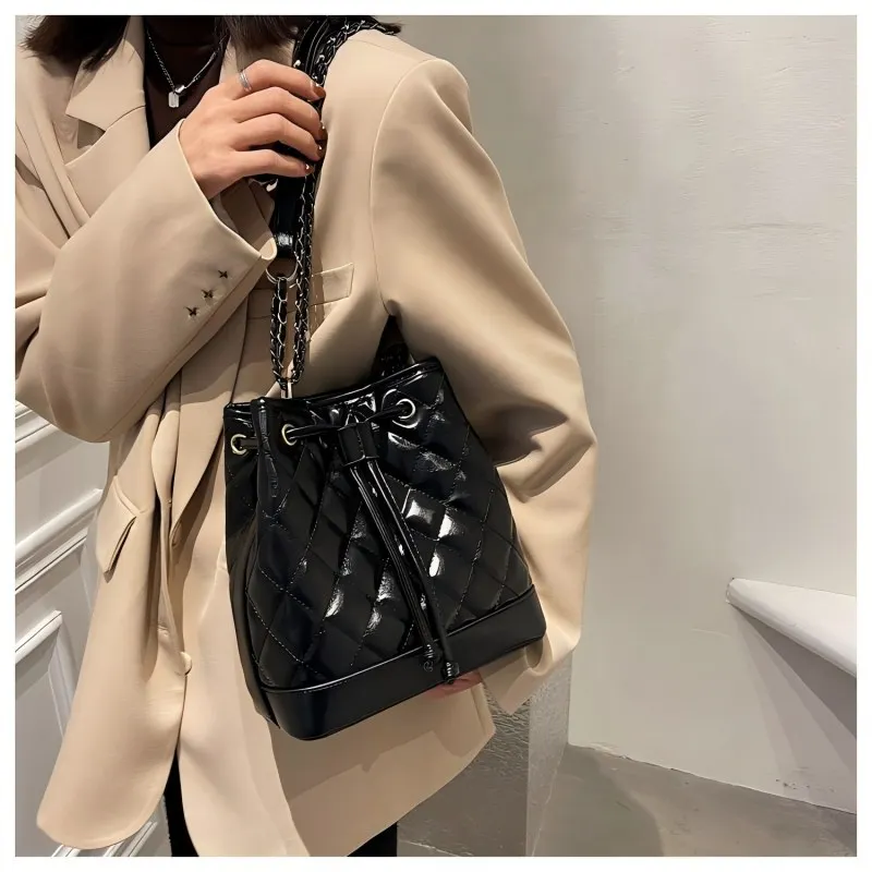 

The Quilted It-Bag. A vintage-inspired bucket bag with diamond stitching for a chic, European summer look.