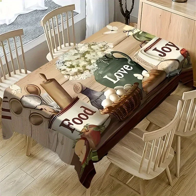 One classic colorful food-themed tablecloth, featuring bread, apples and the word 