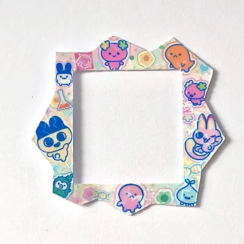 2025 ใหม่ทามาก็อตจิ พาราไดซ์ แฮปปี้ พาร์คสามารถครอบคลุมด้วยแผงกระดาษของเล่นในสต็อกของขวัญสำหรับเด็กชายและเด็กหญิง