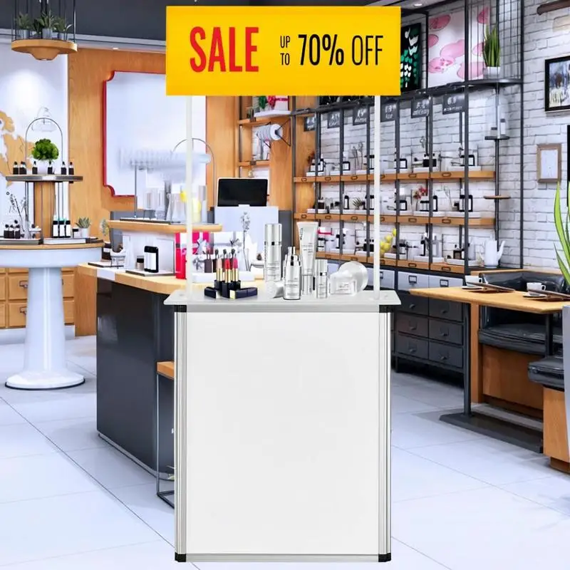 Comptoir d'exposition portable 74 x 10,5 x 91,5 cm en bois, PVC et alliage d'aluminium blanc avec présentoir pliable et support de rangement pour foire, salon, promotion commerciale, stand professionnel