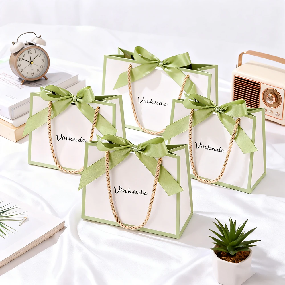 

Premium White Paper Gift Tote Bag for Perfume Cosmetics Small Custom Logo Watch Jewelry Wrapping Beautiful Flowers Packaging