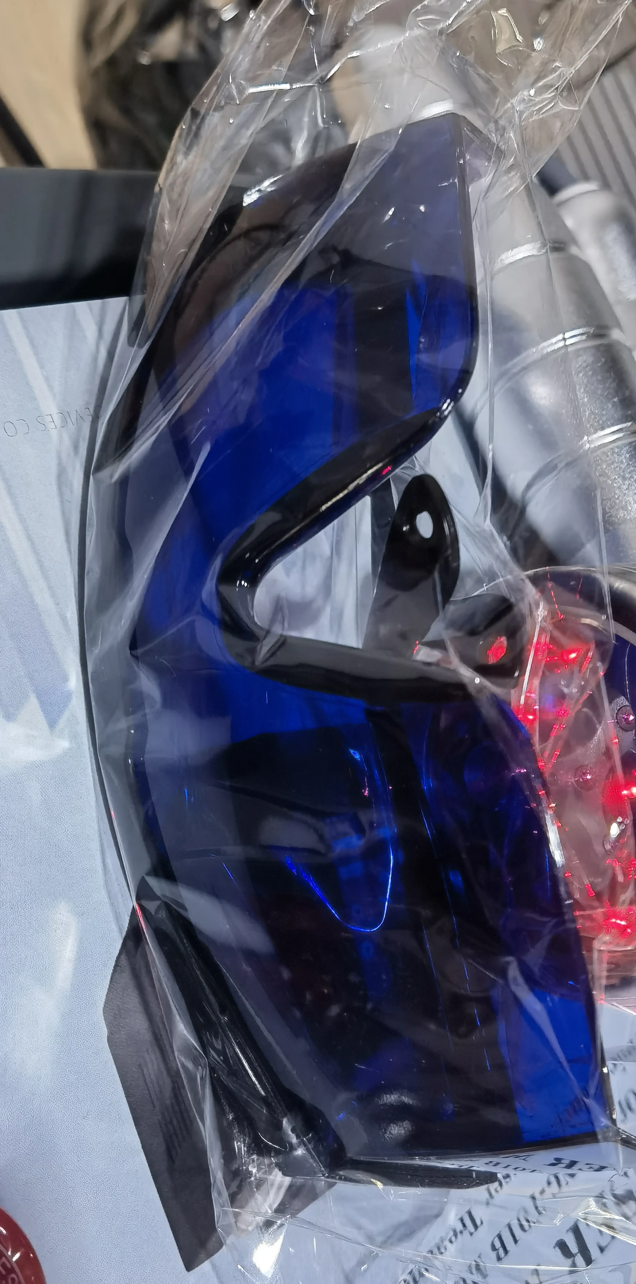 One blue and one green glasses two glasses boxes